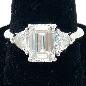 Stunning Platinum Engagement Ring with GIA Certified 1.99 Emerald Shaped Diamond Flanked by a Trillion on Each Side  CR0280